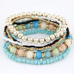 Seven Stacked Blue Gold White Black Bracelets